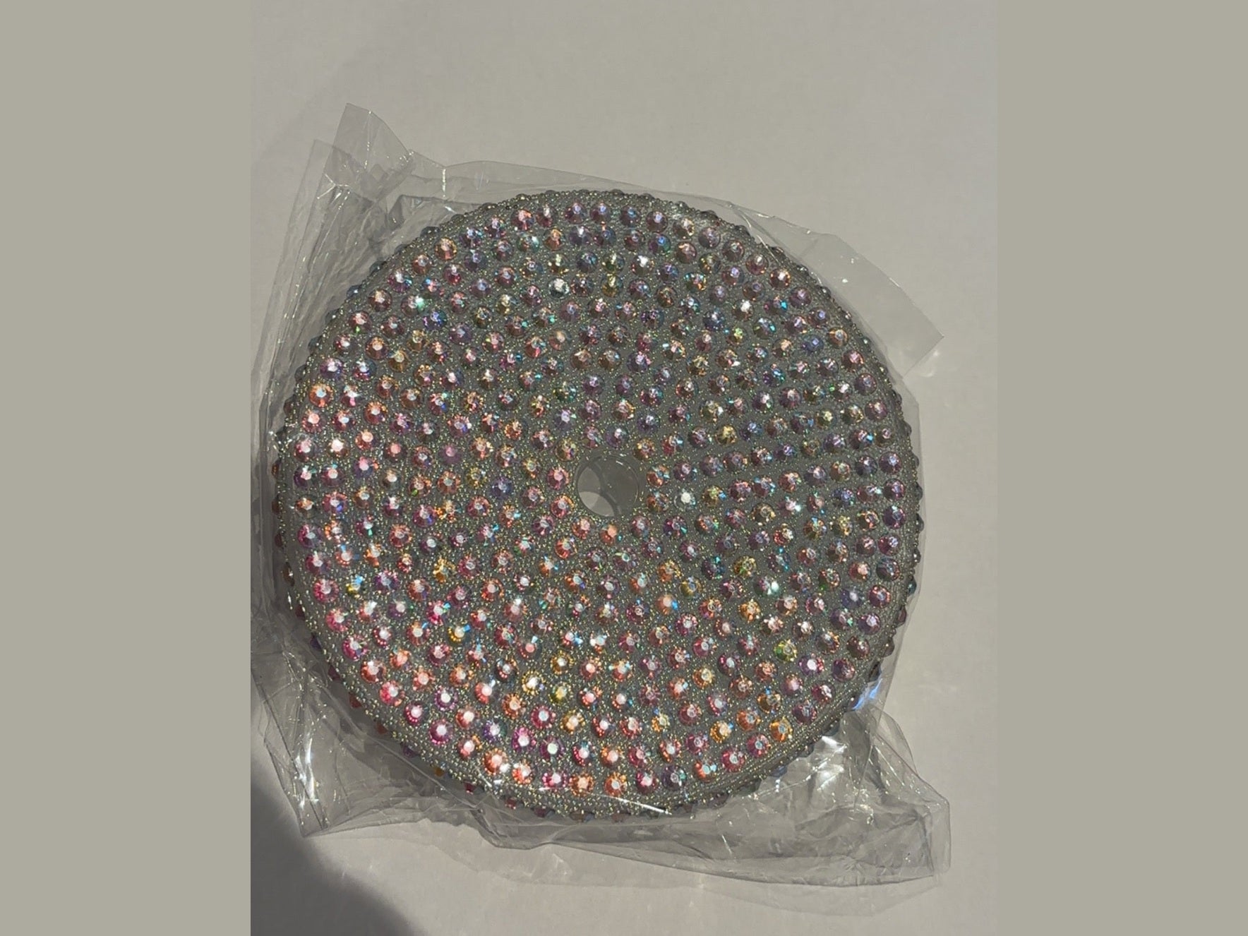 Silver 24oz cup lid featuring multicolored iridescent rhinestone grid pattern