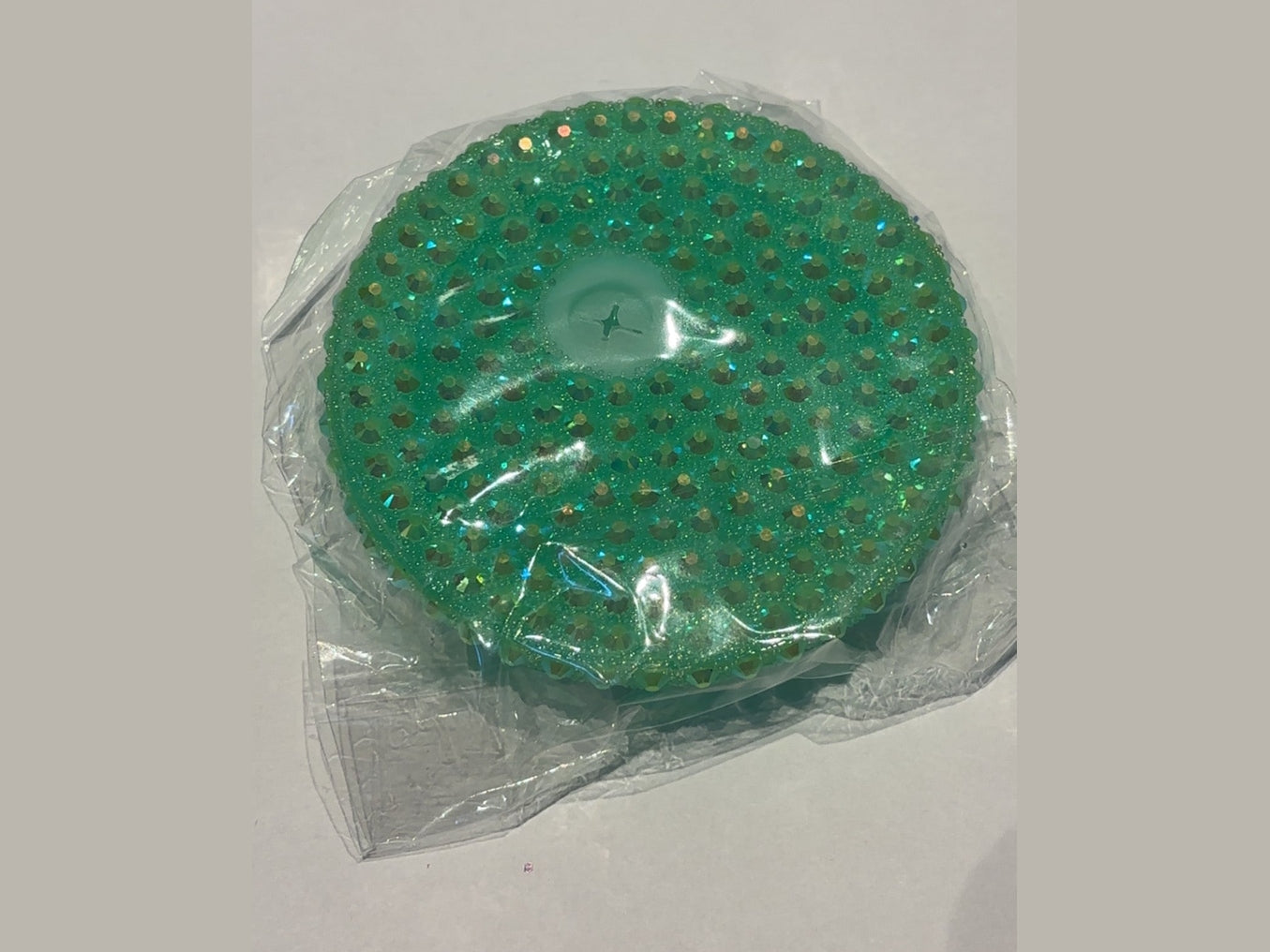 Green glitter 16oz lid with raised iridescent dots and cross-shaped transparent insert
