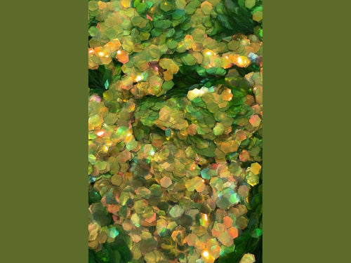 Translucent gold-green hexagonal glitter with iridescent sheen