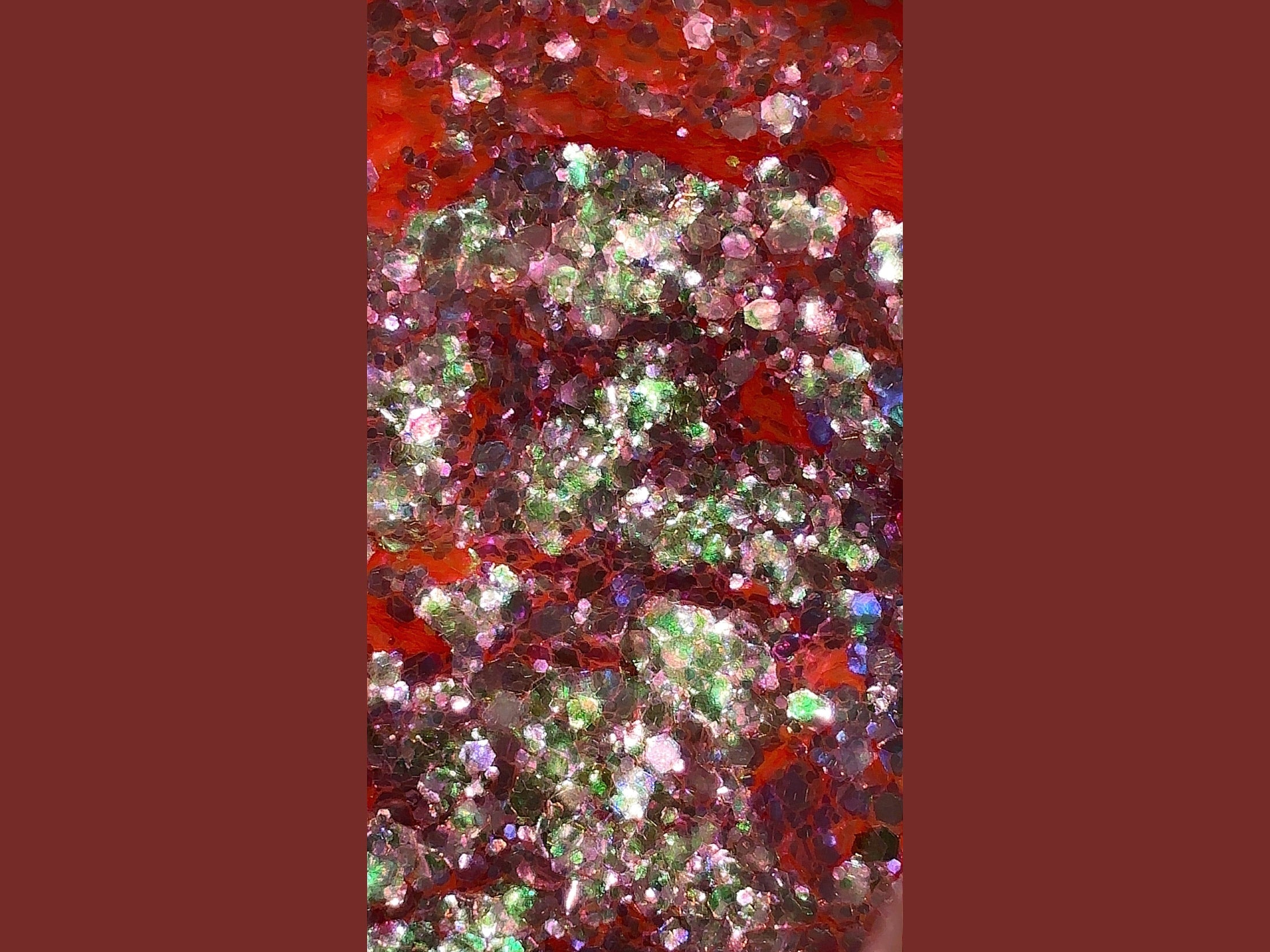 Scarlet Haze pink glitter with silver and green color shift hexagonal particles