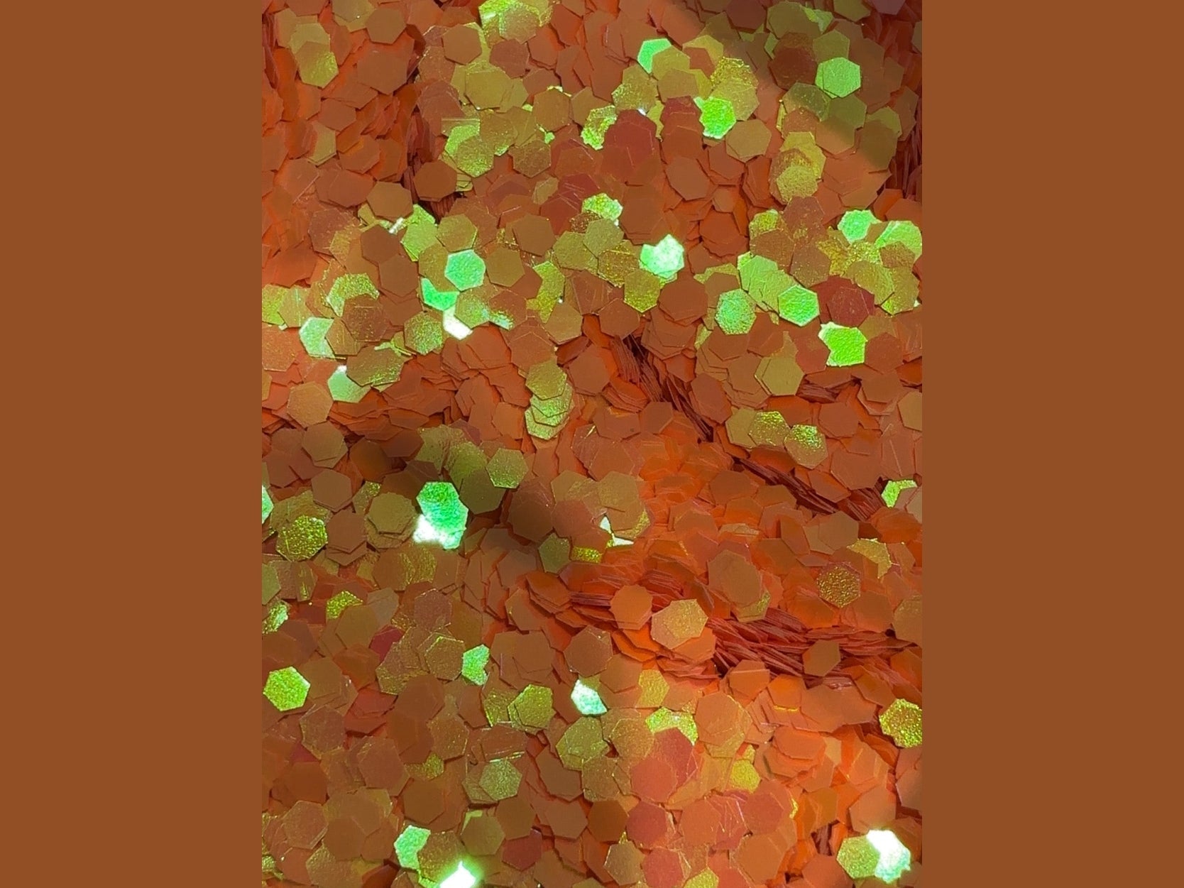 Tangerine Spark chunky hexagonal glitter with orange to yellow color shift