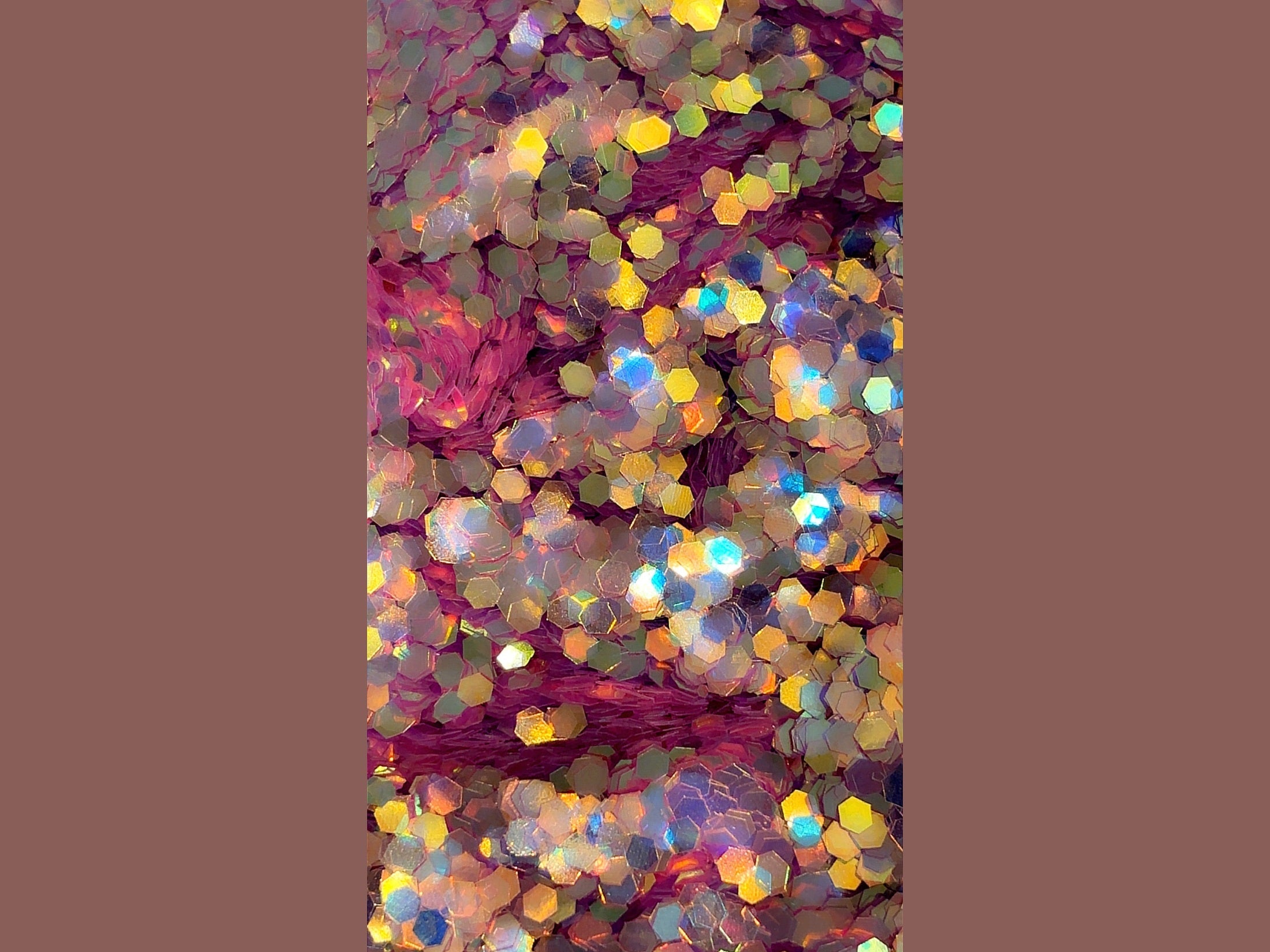 Galaxy Velvet fabric close-up with hexagonal iridescent glitter shifting violet blue gold pink