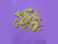 Yellow translucent bone-shaped glow in the dark resin charms