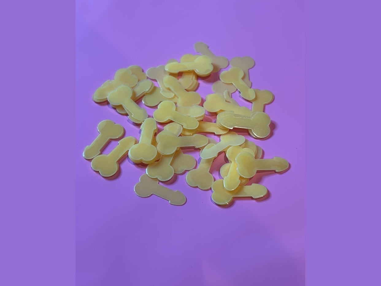 Yellow translucent bone-shaped glow in the dark resin charms