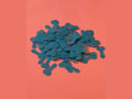 Teal bone-shaped confetti pieces on coral background