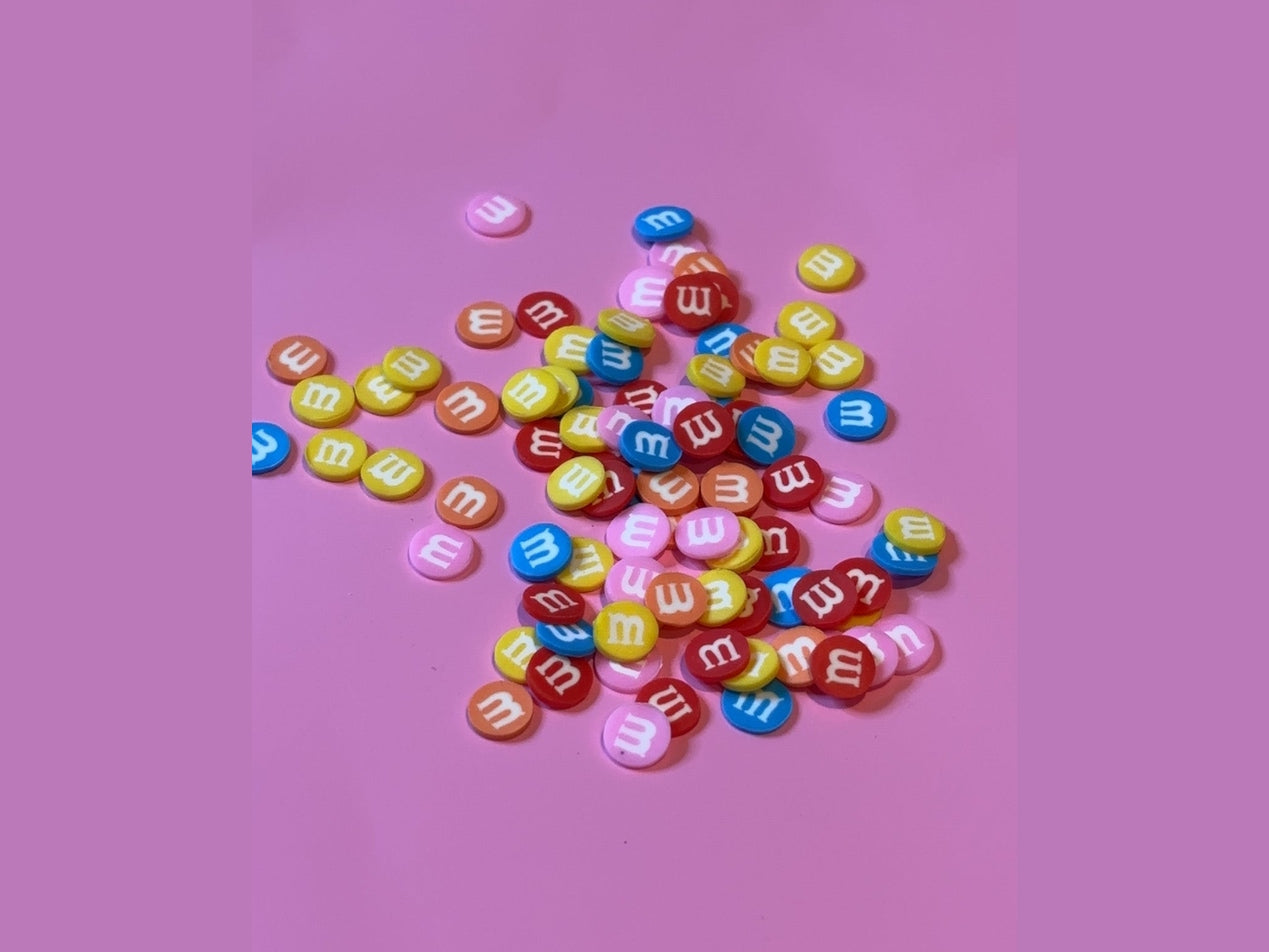 M&M's candy shaped plastic beads in red yellow blue orange pink and white with matte finish