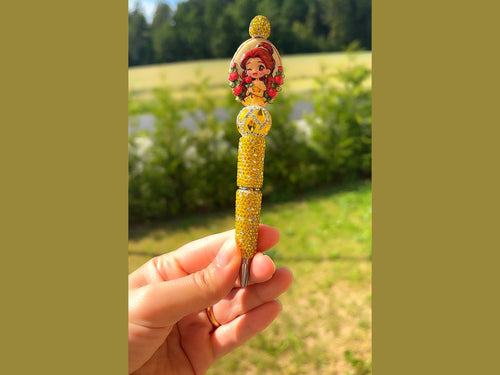 Yellow rhinestone Belle Rose Sparkle Pen with red roses and pumpkin charm